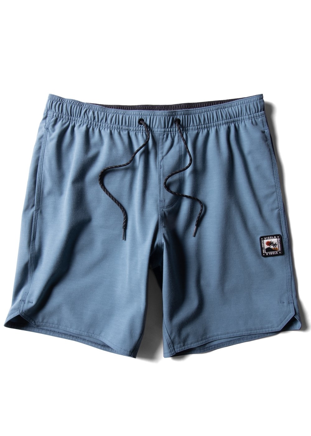 Vissla Solid Sets 17.5" Ecolastic boardshort in tidal blue, front view.