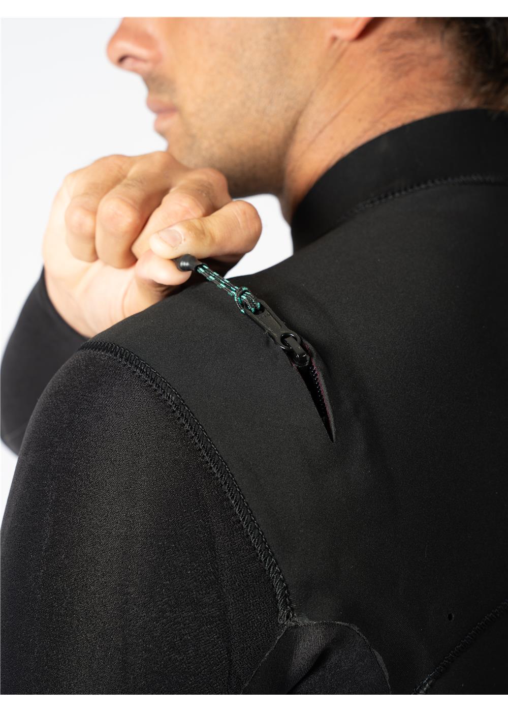 Close-up of wetsuit zipper detail on the back shoulder for easy access.